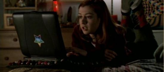 Willow from TV Show Buffy the Vampire Slayer, looking at a computer